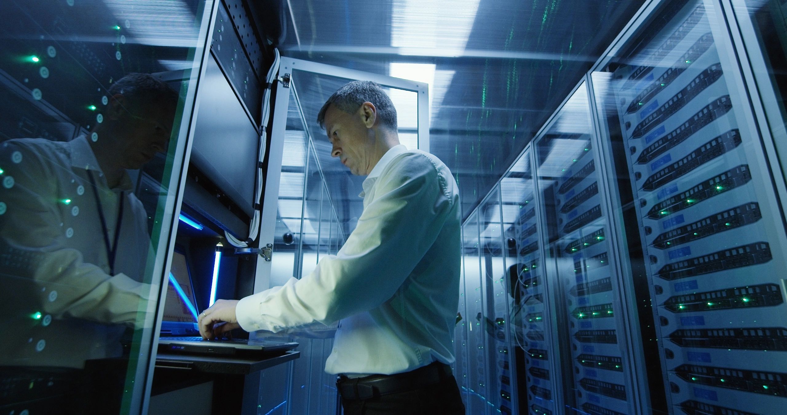 Technician maintaining IT infrastructure in a data center